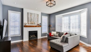 gray couch on brown wooden parquet flooring