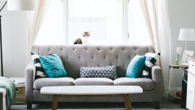 brown and white wooden table beside sofa chair