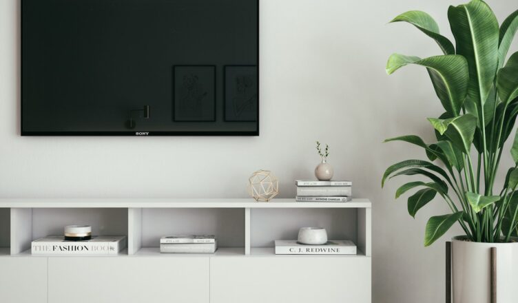 black flat screen tv on white wall